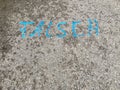 German text Ã¢â¬Å¾FALSCHÃ¢â¬Å wrong painted on asphalt road surface with vibrant bright blue paint. Concrete ground background with Royalty Free Stock Photo